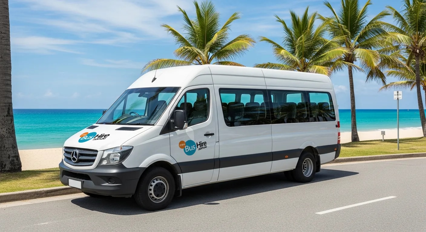 Minibus on a coastal road with blue sky and beach
